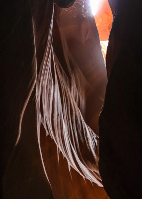 Light highlights streaming sandstone in Antelope Canyon