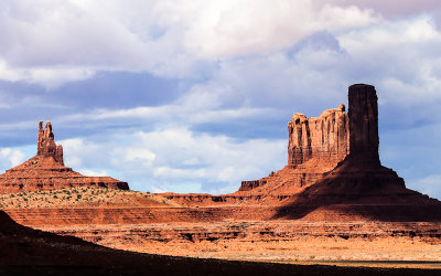 King On His Throne, Stagecoach with Castle Butte shaded by clouds in Monument Valley