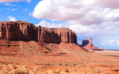 Sentinel Mesa with Castle Butte, Bear and Rabbit and Stagecoach in the background in Monument Valley