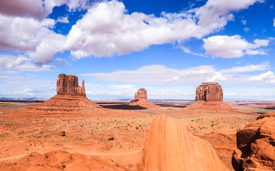 Classic view of West and East Mitten buttes and Merrick Butte from Mitchell Mesa in Monument Valley