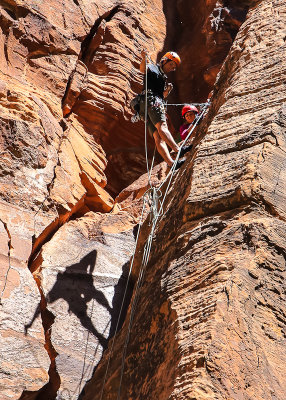 Climbers and shadow on the towering walls in Zion National Park