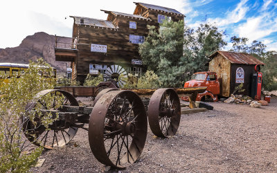 Steel wheeled carriage in front of abandoned building in El Dorado Canyon, Nelson Nevada