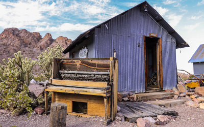 Piano outside a shack in El Dorado Canyon, Nelson Nevada