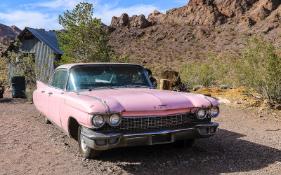 Pink Cadillac with the Eldorado Mountains in the background in El Dorado Canyon, Nelson Nevada