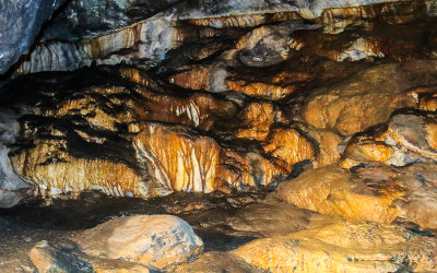 Carmel flowstone over rock in Timpanogos Cave National Monument