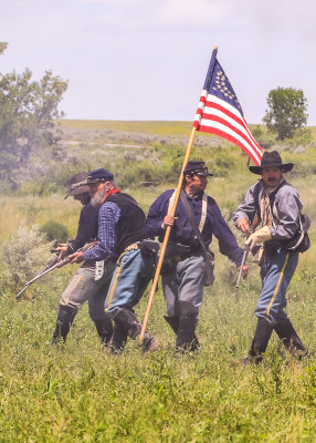 Dismounted 7th Cavalry troops move across the battlefield at the Battle of the Little Bighorn