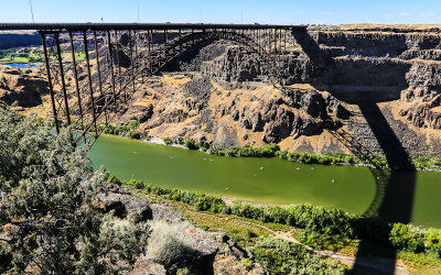 The US 93 Highway Bridge and its shadow in the Snake River Gorge along the Snake River