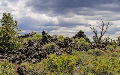 Clouds over the lava flow landscape along the Devils Orchard Nature Trail in Craters of the Moon National Monument