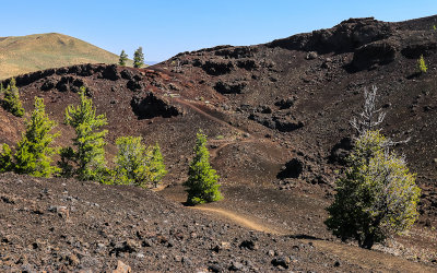 Path winds its way through a crater along the North Crater Trail in Craters of the Moon National Monument