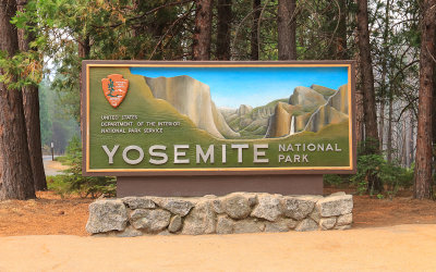Park entrance sign with the view obscured by the 2018 Ferguson Fire in Yosemite National Park