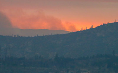 The 2018 Ferguson Fire in the distance at sunset as viewed from the park road in Yosemite National Park