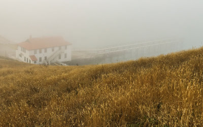 Historic Point Reyes Lifeboat Station (1927) in the fog in Point Reyes National Seashore