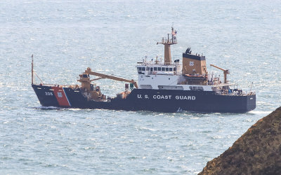 A U.S. Coast Guard ship passes Point Bonita in Golden Gate National Recreational Area