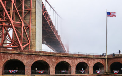 Southern tower of the Golden Gate Bridge in the fog from Fort Point National Historic Site