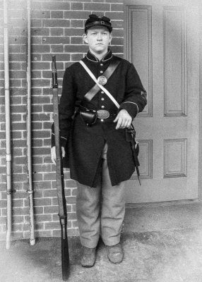 Artillery Soldier guards the entrance to the Officers Quarters in Fort Point National Historic Site