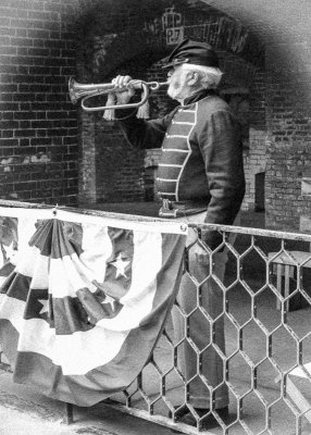 Bugler sounds reveille from the second tier in Fort Point National Historic Site