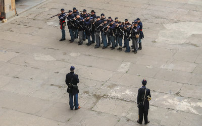 Soldiers perform drills on the parade grounds in Fort Point National Historic Site