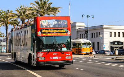 A double-decker tour bus on Embarcadero Street in San Francisco