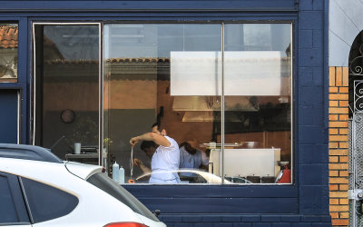 Making spaghetti in a street side cafe in San Francisco