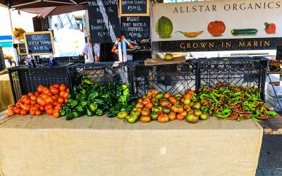 Richly colored organic tomatoes and peppers at the Farmers Market