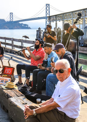 Jazz Band plays in the shadow of the San Francisco Oakland Bay Bridge at the Farmers Market