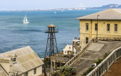 Guard tower and guard house, with the Bay Bridge in the distance, on Alcatraz Island