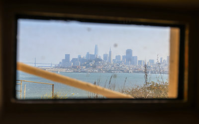 Cellhouse porthole view of San Francisco from Alcatraz Island