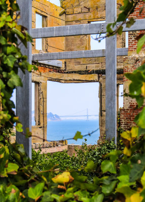 View of the San Francisco  Oakland Bay Bridge through the wardens house on Alcatraz Island