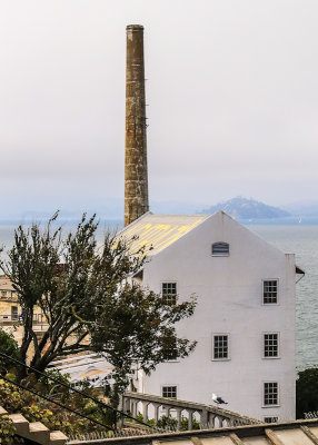 Warehouse with the stack from the power plant behind it on Alcatraz Island