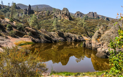 Reflections of the rock formations around the Bear Gulch Reservoir in Pinnacles National Park
