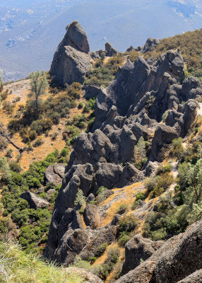 Black volcanic rock formations along the High Peaks Trail in Pinnacles National Park