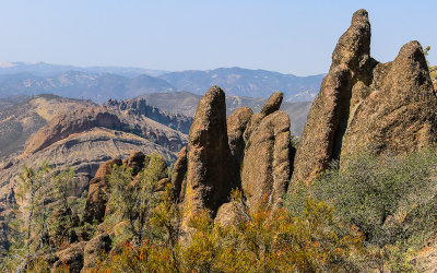 Rock formation with the Balconies in the distance from along the High Peaks Trail in Pinnacles National Park