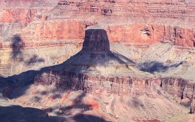 Clouds cover a butte in the canyon as seen from along the South Rim in Grand Canyon NP