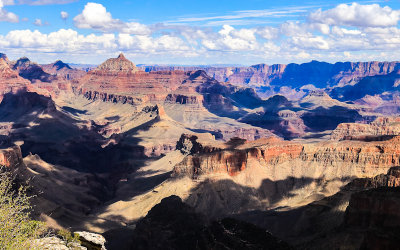 Clouds surround Vishnu Temple as seen from along the South Rim in Grand Canyon NP