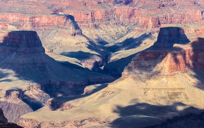 Shadows crawl across the depths of the Grand Canyon as seen from along the South Rim in Grand Canyon NP