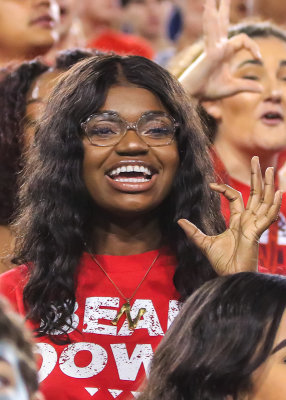Wildcats fan cheers for her team from the student section