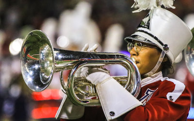 Wildcats horn player performs during halftime