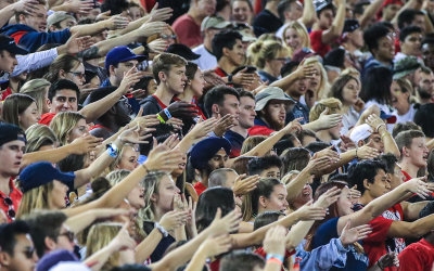 Wildcats fans signal a first down from the student section