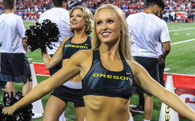 Oregon Ducks Cheerleader performs on the sidelines