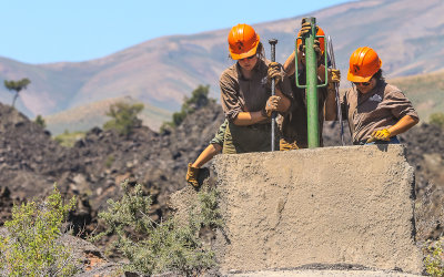 Workers rebuilding a trail in Crater of the Moon National Monument in Idaho