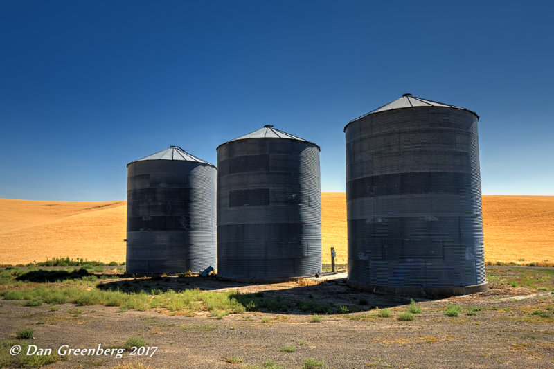 Three Ominous Grain Bins