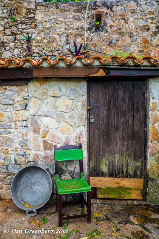 Large Pan, Green Chair and a Locked Door