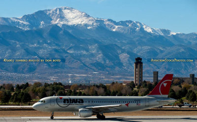 2007 - Northwest Airlines Airbus A-320 N344NW with Pike's Peak in the background
