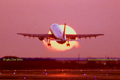 1984 - Eastern Airlines Airbus A-300 taking off in front of the setting sun at Miami International Airport