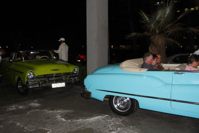 Around 6, almost 100 convertibles rolled, some playing musical horns