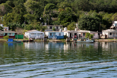 Houses along shore near Bay of Jagua soon after leaving Cienfuegos