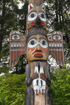 Elaborate totem with eagle, fish and more.