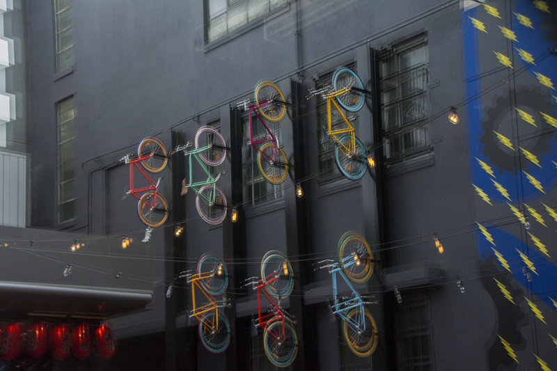 171101 63  Reflection of   1/3 of the Bikes,  shot in DOUBLE pane GLASS, hence the outlines. .
