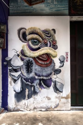 Lion Dance Breaking Out of Wall