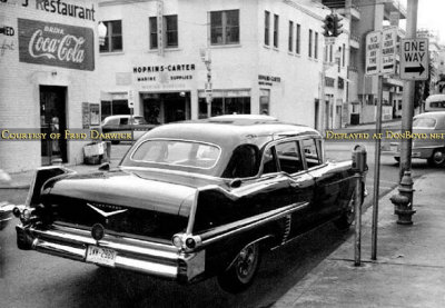 1957 Cadillac Fleetwood Seventy-Five Limo with Hopkins-Carter Marine Supply in the background